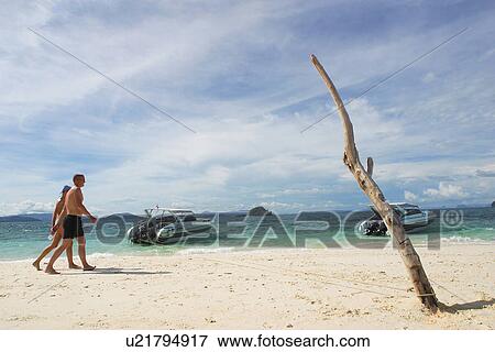 Beach, shore, boats, motor boats, sand, walking View Large Photo Image Stock Photo - Beach, shore, boats, motor boats, sand, walking. Fotosearch