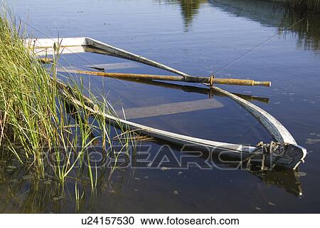 Stock Image - Boat, Day, Grass, Lake. Fotosearch