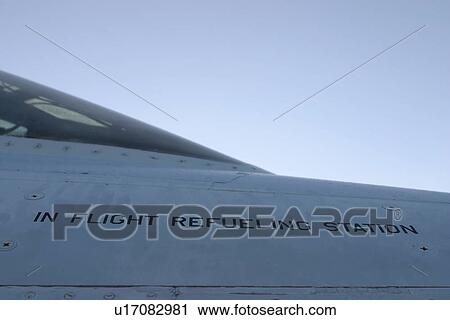 Stock Image - fueling, close-up, machine, outdoors, sky, aviation. Fotosearch