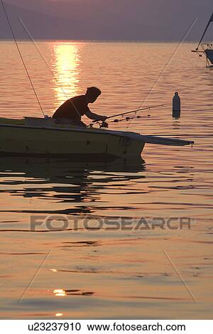 Stock Image - Bending, Boat, Dusk, Fishing, Recreational Pursuit. Fotosearch