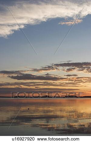 Stock Image - Blue Sky, Calm, Lake, Sea, Amber. Fotosearch