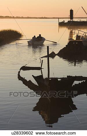 Stock Image - Boat, Dusk, Grass, Horizon, Lake. Fotosearch