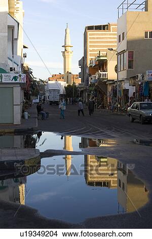 Picture - Building Exterior, Building Structure, Car, Day, Group Of People. Fotosearch