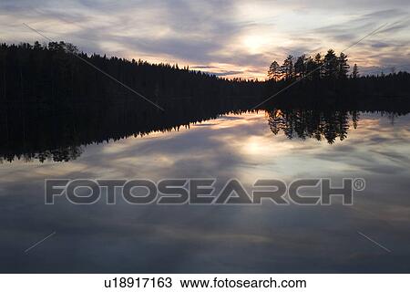 Stock Image - Cloud, Glow, Lake, Moody Sky. Fotosearch