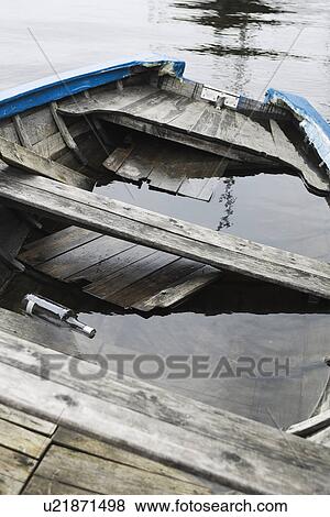 Battered, Boat, Bottle, Canoe, Condition View Large Photo Image Stock Photo - Battered, Boat, Bottle, Canoe, Condition. Fotosearch