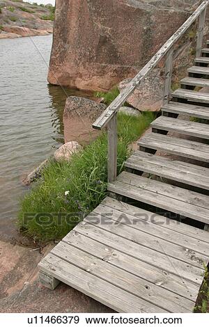 Stock Photo - stairs, steps, wood, wooden, surface, grass. Fotosearch