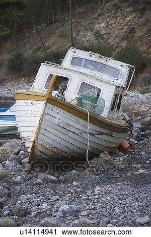 Stock Image - Boat, Stones, Rocks, Riverside. Fotosearch