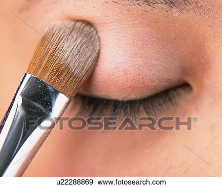 A Woman Applying Beige-Colored Eye Shadow, Front View, Differential Focus View Large Photo Image Stock Photo - A Woman Applying Beige-Colored Eye Shadow, Front View, Differential Focus. Fotosearch