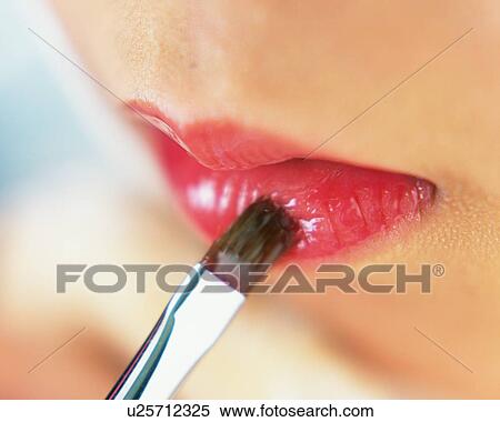 A Woman Applying Lip Gloss, Differential Focus View Large Photo Image Stock Photography - A Woman Applying Lip Gloss, Differential Focus. Fotosearch