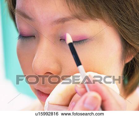 A Woman Applying Pink-Colored Eye Shadow, Differential Focus View Large Photo Image Stock Photograph - A Woman Applying Pink-Colored Eye Shadow, Differential Focus. Fotosearch