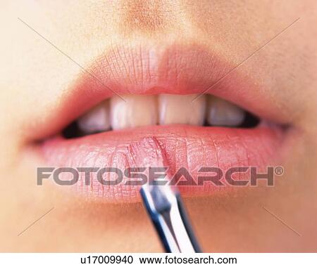 A Woman Applying Pink-Colored Lip Gloss, Front View, Differential Focus View Large Photo Image Stock Image - A Woman Applying Pink-Colored Lip Gloss, Front View, Differential Focus. Fotosearch
