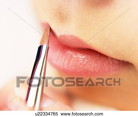 A Woman Applying Pink-Colored Lip Gloss, Differential Focus View Large Photo Image Stock Photography - A Woman Applying Pink-Colored Lip Gloss, Differential Focus. Fotosearch