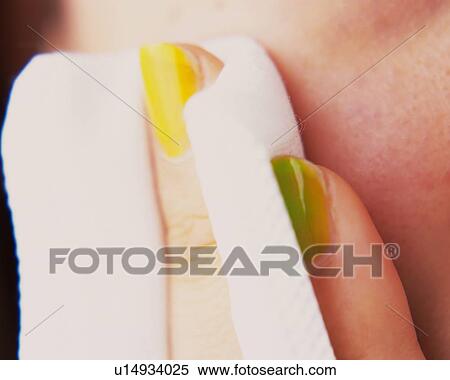 A Woman Patting Cheek With a Cotton, Differential Focus View Large Photo Image Stock Photography - A Woman Patting Cheek With a Cotton, Differential Focus. Fotosearch