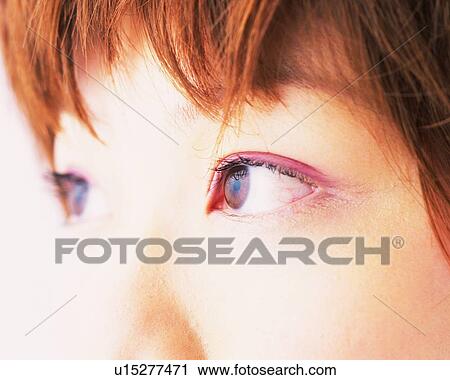 Stock Image - A Woman Wearing Pink-Colored Eye Shadow, Differential Focus. Fotosearch