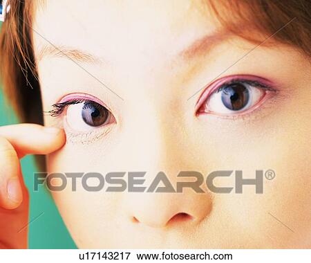 A Woman Wearing Pink-Colored Eye Shadow, Looking at Camera, Differential Focus View Large Photo Image Stock Photo - A Woman Wearing Pink-Colored Eye Shadow, Looking at Camera, Differential Focus. Fotosearch