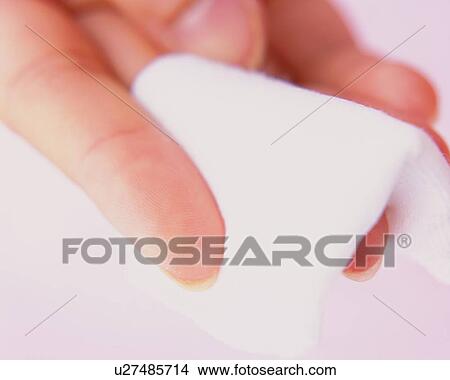 Picture - Closed Up Image of a Hand Holding a Cotton, Differential Focus. Fotosearch