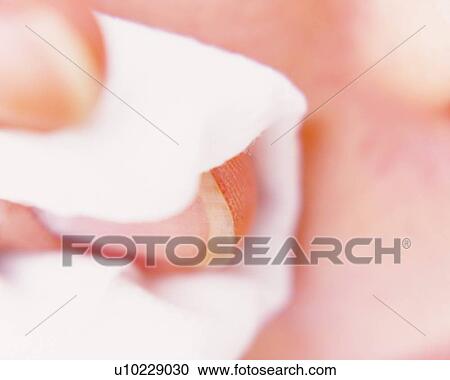 Stock Image - Closed Up Image of a Hand Holding a Cotton, Differential Focus. Fotosearch