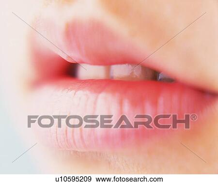 Stock Photo - Closed Up Image of Feminine Lips, Differential Focus. Fotosearch