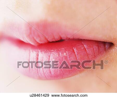 Stock Photo - Closed Up Image of Feminine Lips, Differential Focus. Fotosearch