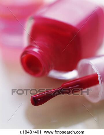 Stock Image - Closed Up Image of Red-Colored Manicure Bottles, Differential Focus. Fotosearch