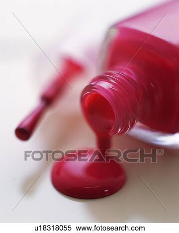 Stock Photography - Closed Up Image of Red-Colored Manicure Bottle, Differential Focus. Fotosearch