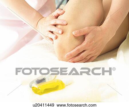 Aesthetician Who Anoints Woman's Knee With Oil View Large Photo Image Stock Photo - Aesthetician Who Anoints Woman's Knee With Oil. Fotosearch