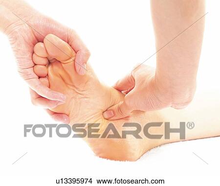Aesthetician Who Massages Bottom of Woman's Foot, Close Up View Large Photo Image Picture - Aesthetician Who Massages Bottom of Woman's Foot, Close Up. Fotosearch