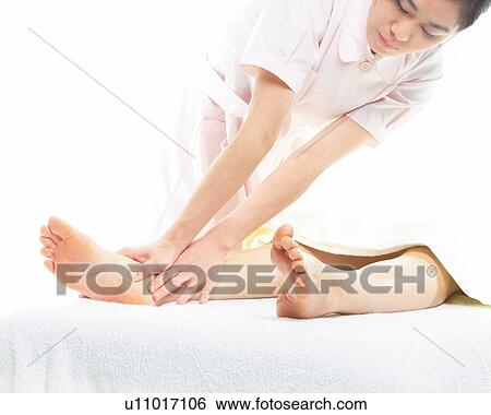 Aesthetician Who Massages Bottom of Woman's Foot View Large Photo Image Stock Photograph - Aesthetician Who Massages Bottom of Woman's Foot. Fotosearch