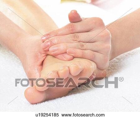 Aesthetician Who Massages Bottom of Woman's Foot, Close Up View Large Photo Image Stock Photography - Aesthetician Who Massages Bottom of Woman's Foot, Close Up. Fotosearch