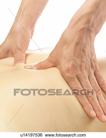 Stock Photograph - Aesthetician Who Massages Woman's Back, Close Up. Fotosearch