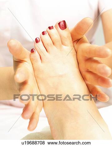 Stock Photo - Aesthetician Who Massages Woman's Foot, Close Up. Fotosearch