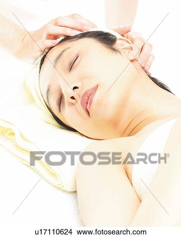 Picture - Aesthetician Who Massages Woman's Head, High Angle View. Fotosearch