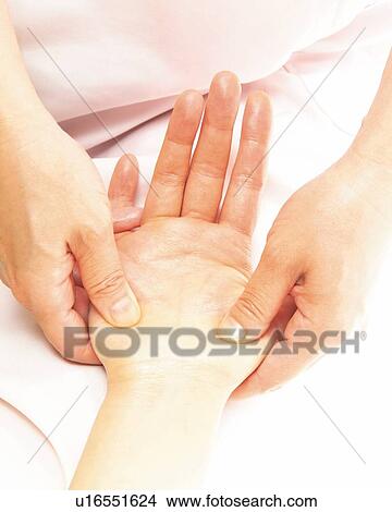 Aesthetician Who Massages Woman's Palm, High Angle View View Large Photo Image Picture - Aesthetician Who Massages Woman's Palm, High Angle View. Fotosearch