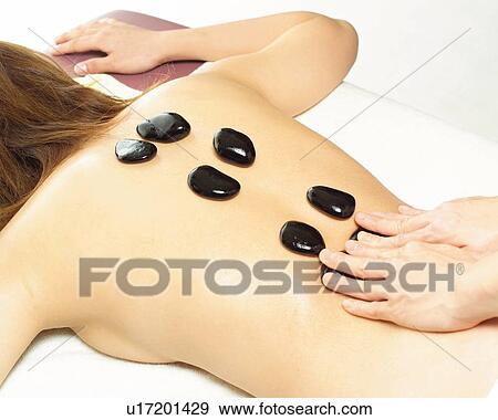 Aesthetician Who Pushes Woman's Back With Stones, High Angle View View Large Photo Image Stock Photo - Aesthetician Who Pushes Woman's Back With Stones, High Angle View. Fotosearch
