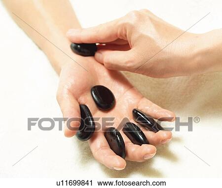 Aesthetician Who Pushes Woman's Hand With Stones, High Angle View, Close Up View Large Photo Image Stock Image - Aesthetician Who Pushes Woman's Hand With Stones, High Angle View, Close Up. Fotosearch
