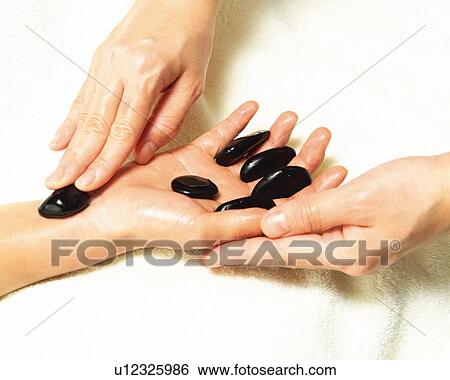 Aesthetician Who Pushes Woman's Hand With Stones, High Angle View, Close Up View Large Photo Image Stock Photograph - Aesthetician Who Pushes Woman's Hand With Stones, High Angle View, Close Up. Fotosearch