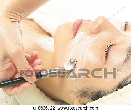 Aesthetician Who Rubs Cream on Woman's Face with the Pallet, Side View View Large Photo Image Stock Image - Aesthetician Who Rubs Cream on Woman's Face with the Pallet, Side View. Fotosearch