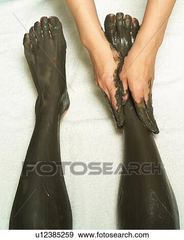 Aesthetician Who Rubs Mud Pack on Woman's Leg, High Angle View View Large Photo Image Stock Photo - Aesthetician Who Rubs Mud Pack on Woman's Leg, High Angle View. Fotosearch
