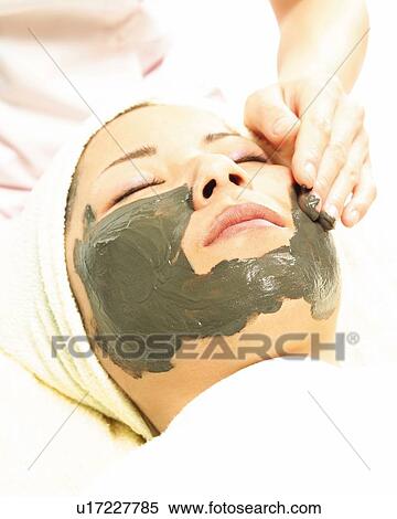Aesthetician Who Rubs Mud Pack on Woman's Face, High Angle View View Large Photo Image Stock Photography - Aesthetician Who Rubs Mud Pack on Woman's Face, High Angle View. Fotosearch