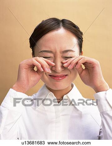 Stock Image - Crying Young Woman, Front View. Fotosearch