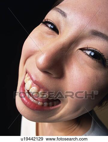 Laughing Young Woman, High Angle View, Close Up, Looking at Camera View Large Photo Image Stock Photo - Laughing Young Woman, High Angle View, Close Up, Looking at Camera. Fotosearch