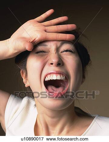 Stock Photo - Shouting Young Woman, Front View. Fotosearch