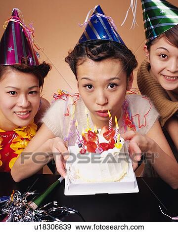 Three Young Women Having a Birthday Party, Front View, Looking at Camera View Large Photo Image Stock Photo - Three Young Women Having a Birthday Party, Front View, Looking at Camera. Fotosearch