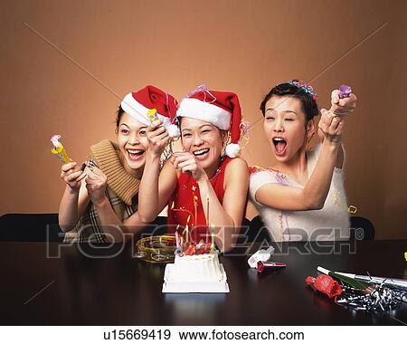 Three Young Women Having a Party, Front View View Large Photo Image Stock Photo - Three Young Women Having a Party, Front View. Fotosearch