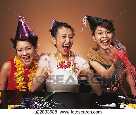 Three Young Women Having a Party, Front View View Large Photo Image Stock Photo - Three Young Women Having a Party, Front View. Fotosearch