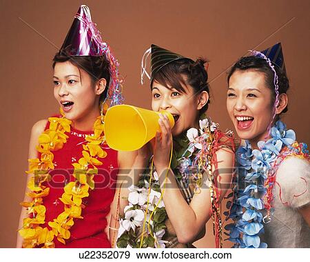 Stock Photo - Three Young Women Having a Party, Side View. Fotosearch