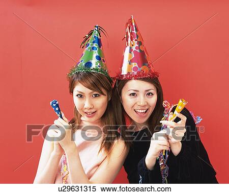 Two Young Women Having a Party, Front View, Looking at Camera View Large Photo Image Stock Photography - Two Young Women Having a Party, Front View, Looking at Camera. Fotosearch