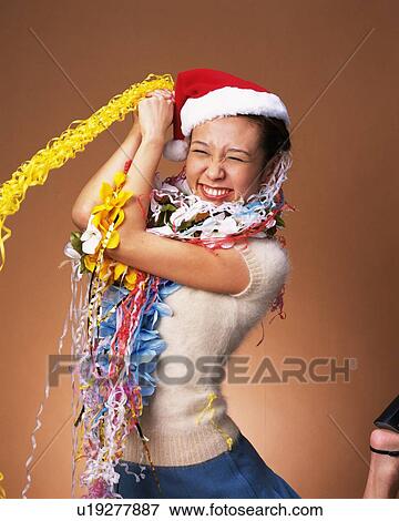 Stock Photo - Young Woman Having a Party, Front View, Looking at Camera. Fotosearch
