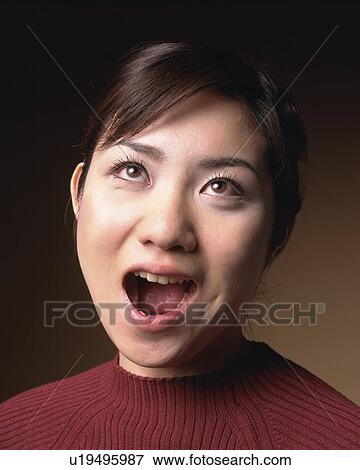 Young Woman Opening Mouth, Front View View Large Photo Image Stock Photo - Young Woman Opening Mouth, Front View. Fotosearch