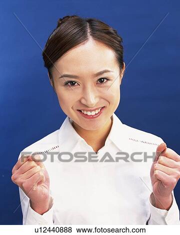 Stock Photo - Young Woman Posing Victory, Front View, Looking at Camera . Fotosearch